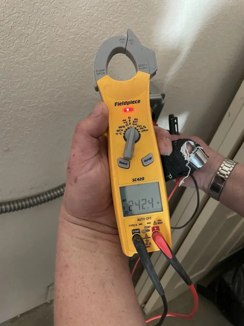 Voltage testing with clamp meter during Ceiling Fan Installation in Westville